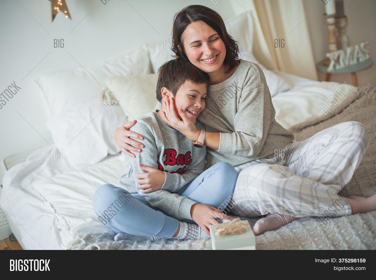 mom and boy in bed