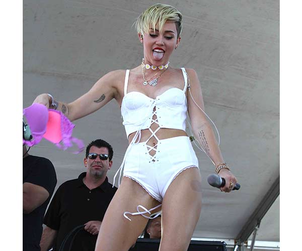 david andro recommends miley cyrus camel tow pic
