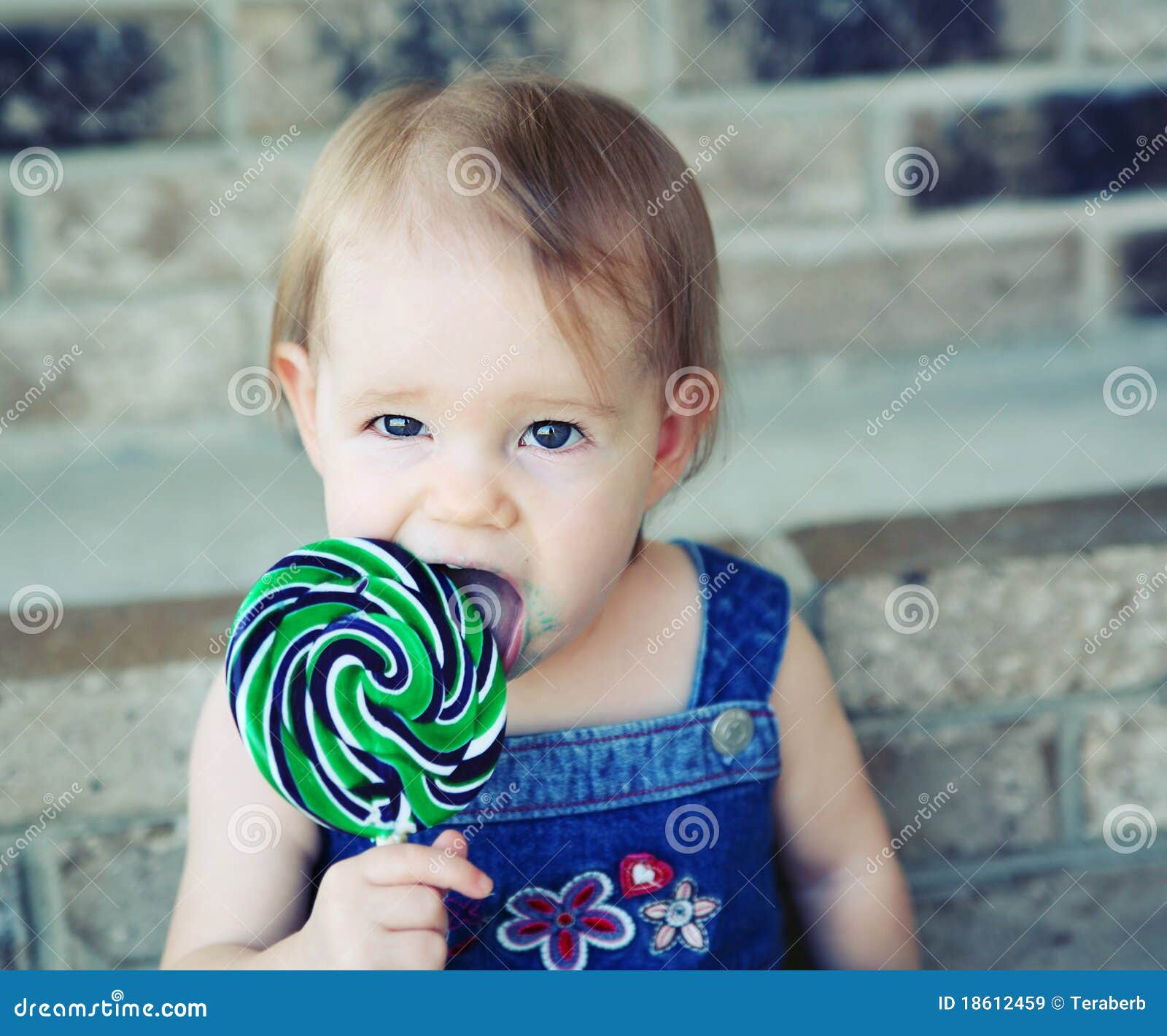 licking a lollipop