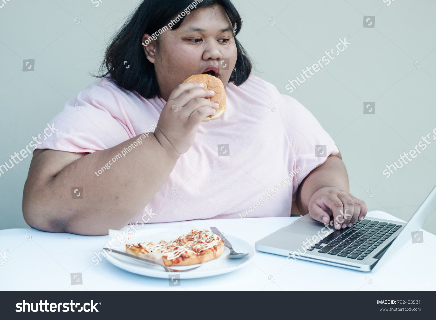 Fat Girl On Computer shot redhead