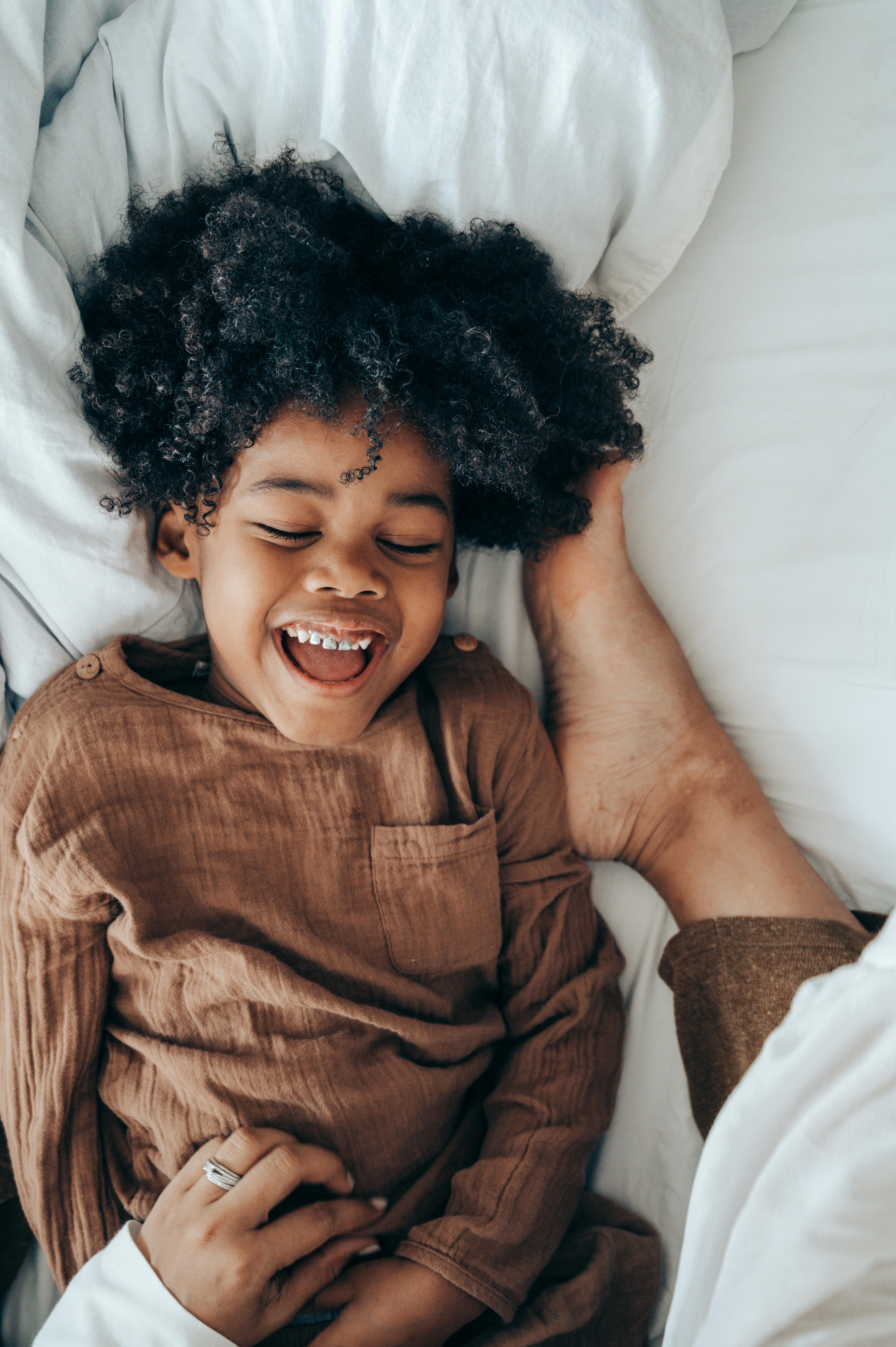 chuck kowalchuk add mom and boy in bed photo