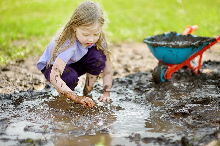 women playing in mud